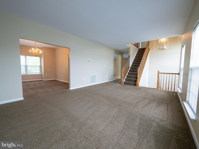 73 Marblehead Rd, Inwood, WV 25428 - unfurnished living room with a chandelier, carpet flooring, baseboards, and stairway