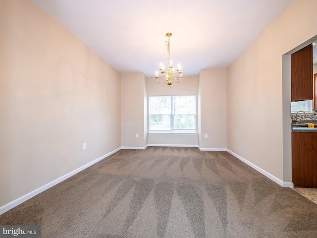 73 Marblehead Rd, Inwood, WV 25428 - empty room featuring a chandelier, carpet flooring, and baseboards