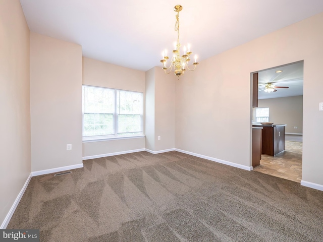 73 Marblehead Rd, Inwood, WV 25428 - empty room featuring carpet flooring, a chandelier, baseboards, and ceiling fan