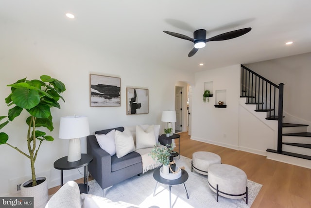 5446 Varnum St, Bladensburg, MD 20710 - living room featuring wood finished floors, stairway, a ceiling fan, recessed lighting, and arched walkways