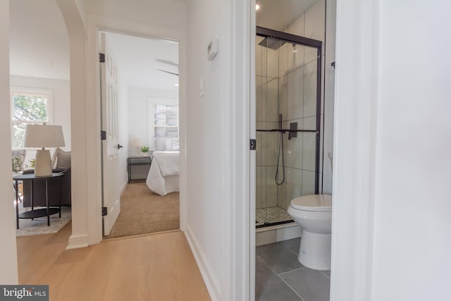 5446 Varnum St, Bladensburg, MD 20710 - ensuite bathroom featuring a shower stall, toilet, wood finished floors, and baseboards