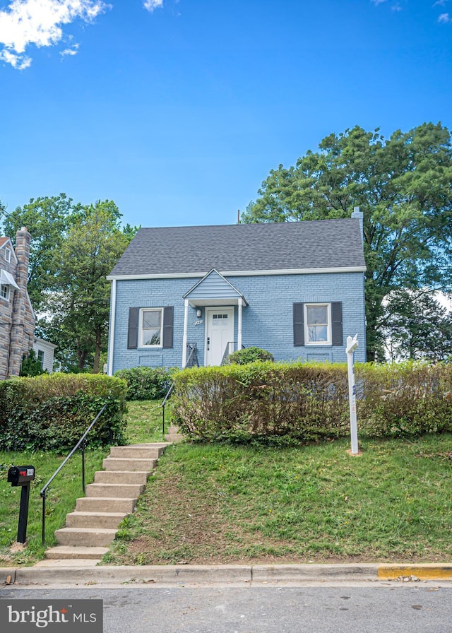 5446 Varnum St, Bladensburg, MD 20710 - bungalow-style house with brick siding, a front lawn, and a shingled roof