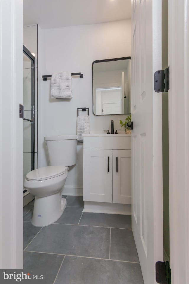 5446 Varnum St, Bladensburg, MD 20710 - full bath with toilet, tile patterned flooring, vanity, a shower with door, and baseboards