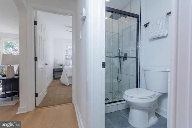 5446 Varnum St, Bladensburg, MD 20710 - bathroom featuring a shower stall, toilet, baseboards, and wood finished floors
