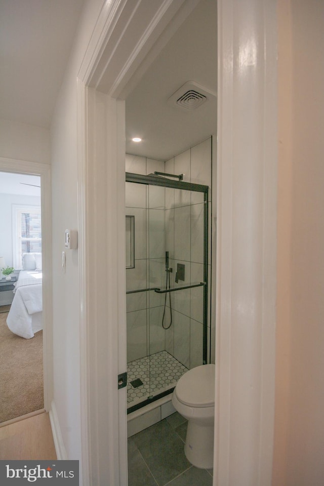 5446 Varnum St, Bladensburg, MD 20710 - full bathroom featuring a shower stall, toilet, connected bathroom, and tile patterned flooring