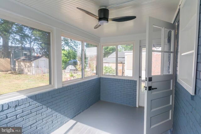 5446 Varnum St, Bladensburg, MD 20710 - unfurnished sunroom featuring a ceiling fan and brick wall
