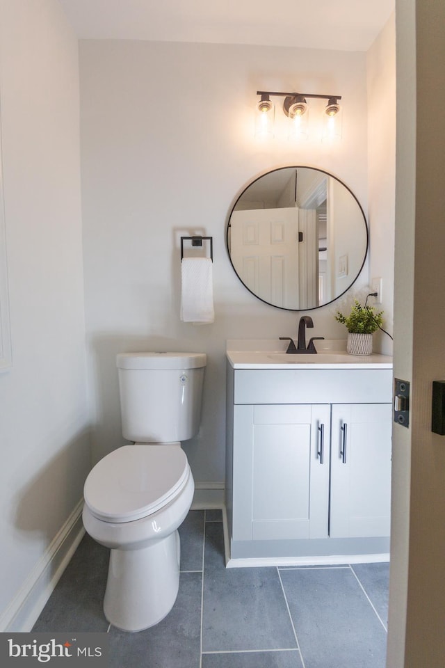 5446 Varnum St, Bladensburg, MD 20710 - half bathroom with vanity, toilet, baseboards, and tile patterned floors