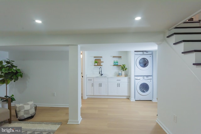 5446 Varnum St, Bladensburg, MD 20710 - laundry area with stacked washer / drying machine, light wood-type flooring, wet bar, recessed lighting, and baseboards