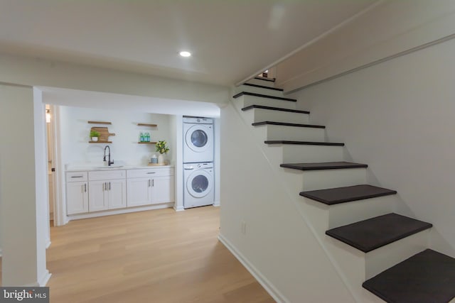 5446 Varnum St, Bladensburg, MD 20710 - staircase featuring stacked washer and clothes dryer, wood finished floors, recessed lighting, bar, and baseboards