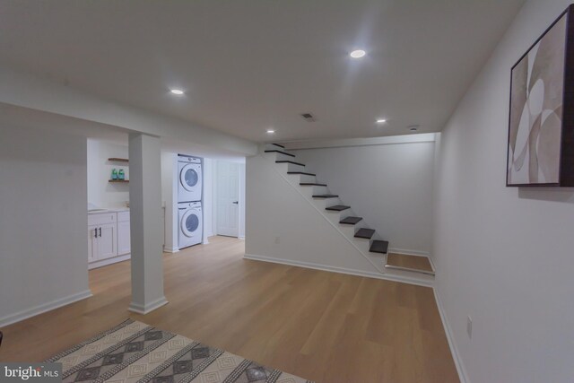 5446 Varnum St, Bladensburg, MD 20710 - finished below grade area featuring stacked washing machine and dryer, light wood-style floors, recessed lighting, stairway, and baseboards