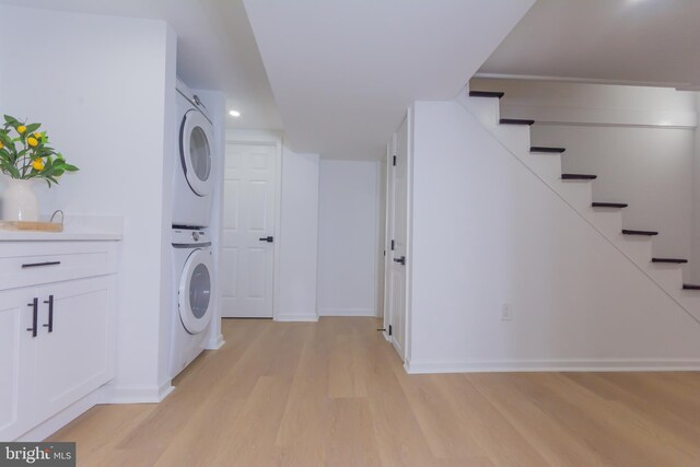 5446 Varnum St, Bladensburg, MD 20710 - laundry room with stacked washing machine and dryer, light wood-style floors, baseboards, and recessed lighting