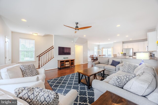 living area featuring dark wood-style floors, ceiling fan, stairs, recessed lighting, and baseboards