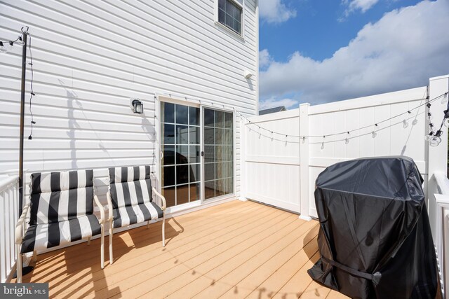 deck featuring a grill