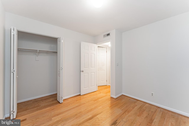 2605 S Walter Reed Dr Unit A, Arlington, VA 22206 - unfurnished bedroom featuring wood finished floors and a closet