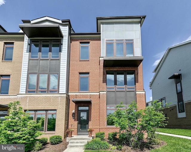 view of front of property featuring brick siding