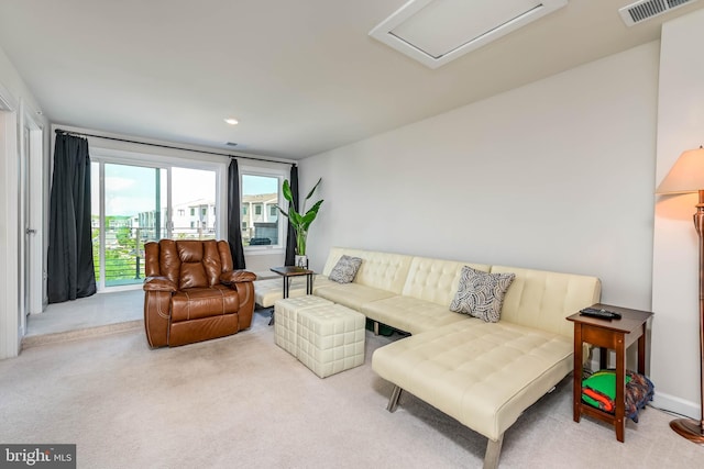 living room featuring carpet flooring, attic access, and recessed lighting
