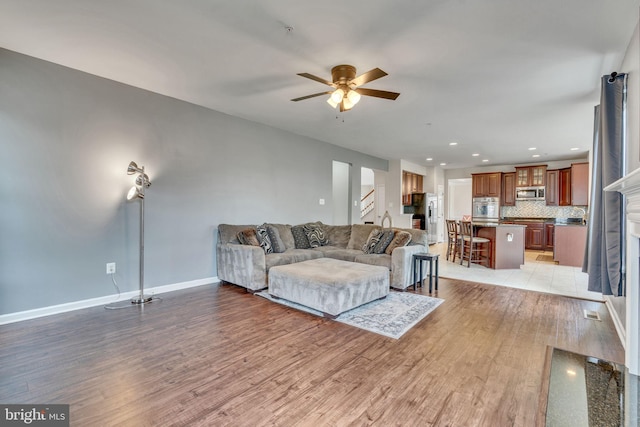 2708 Lake Forest Dr, Upper Marlboro, MD 20774 - living room featuring light wood-style flooring, a ceiling fan, stairway, baseboards, and recessed lighting