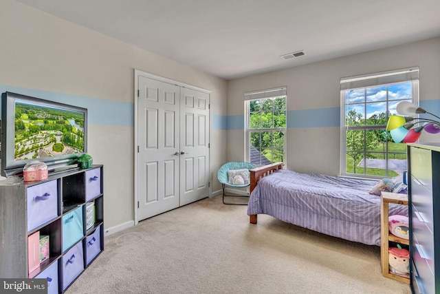 2708 Lake Forest Dr, Upper Marlboro, MD 20774 - bedroom with carpet flooring, a closet, and baseboards