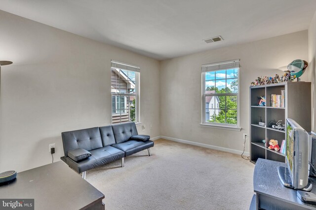 2708 Lake Forest Dr, Upper Marlboro, MD 20774 - living room with healthy amount of natural light, carpet floors, and baseboards