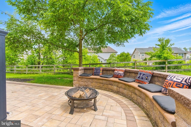 2708 Lake Forest Dr, Upper Marlboro, MD 20774 - view of patio featuring an outdoor fire pit, a fenced backyard, and a residential view