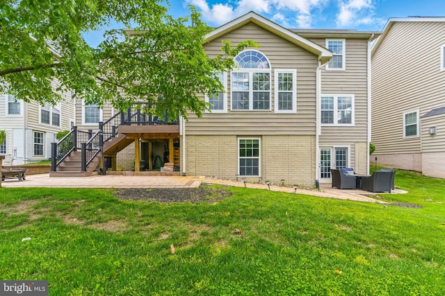 2708 Lake Forest Dr, Upper Marlboro, MD 20774 - rear view of property featuring a patio area, a lawn, stairway, and a wooden deck