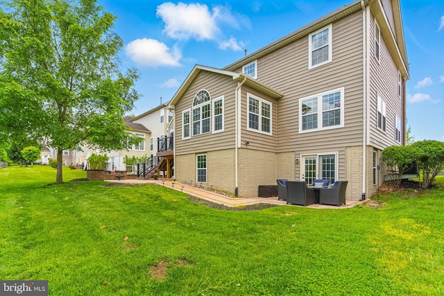 2708 Lake Forest Dr, Upper Marlboro, MD 20774 - back of property featuring outdoor lounge area, a patio, a lawn, and stairs