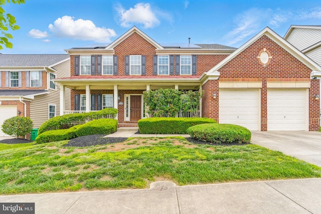 2708 Lake Forest Dr, Upper Marlboro, MD 20774 - view of front of property with brick siding, driveway, a porch, and an attached garage