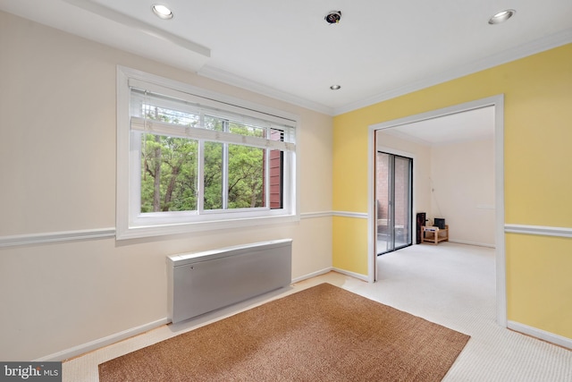 carpeted empty room with baseboards, recessed lighting, and ornamental molding