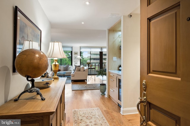 700 New Hampshire Ave NW Unit 507, Washington, DC 20037 - entrance foyer with light wood-style flooring, recessed lighting, and wine cooler