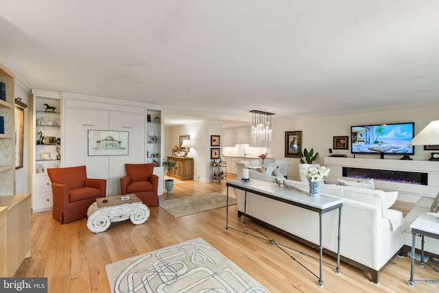 700 New Hampshire Ave NW Unit 507, Washington, DC 20037 - living area with wood finished floors and a chandelier