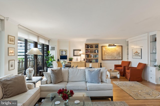700 New Hampshire Ave NW Unit 507, Washington, DC 20037 - living room with wood finished floors, crown molding, and built in features