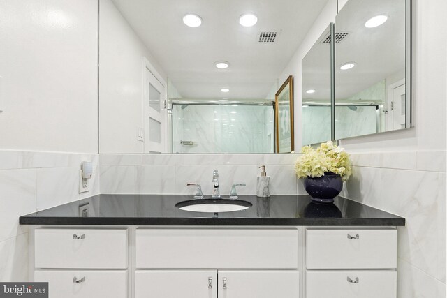 700 New Hampshire Ave NW Unit 507, Washington, DC 20037 - full bathroom featuring a stall shower, recessed lighting, vanity, and backsplash