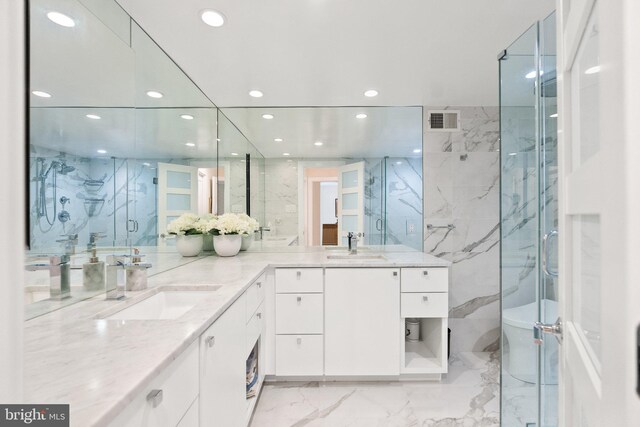 700 New Hampshire Ave NW Unit 507, Washington, DC 20037 - bathroom with marble tiled flooring, recessed lighting, a marble finish shower, and double vanity