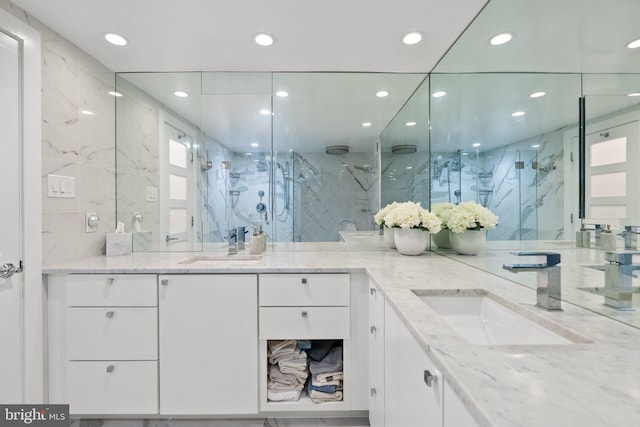 700 New Hampshire Ave NW Unit 507, Washington, DC 20037 - full bathroom featuring a marble finish shower, recessed lighting, and double vanity