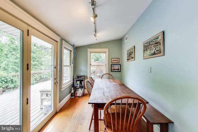 7017 Woodland Ave, Takoma Park, MD 20912 - dining area with rail lighting and light wood-type flooring