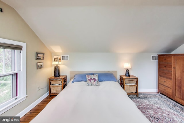 7017 Woodland Ave, Takoma Park, MD 20912 - bedroom featuring lofted ceiling, dark wood-style floors, and baseboards