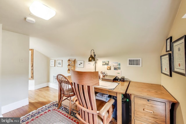 7017 Woodland Ave, Takoma Park, MD 20912 - home office with vaulted ceiling, wood finished floors, and baseboards