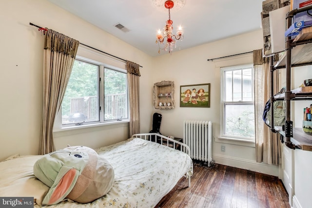 7017 Woodland Ave, Takoma Park, MD 20912 - bedroom with radiator, hardwood / wood-style floors, multiple windows, and baseboards