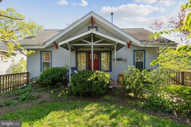 7017 Woodland Ave, Takoma Park, MD 20912 - view of front of property with fence and a shingled roof