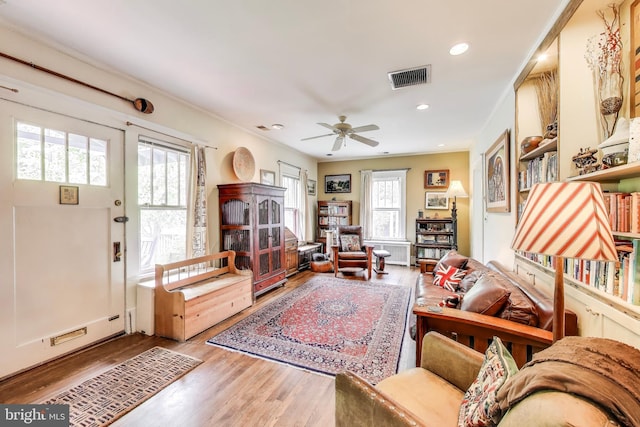 7017 Woodland Ave, Takoma Park, MD 20912 - living room featuring wood finished floors, a ceiling fan, recessed lighting, and crown molding
