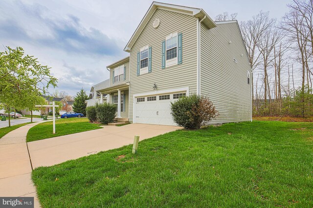 596 Claiborne Road, North East, MD 21901 - view of front facade featuring concrete driveway, a garage, a front lawn, and a balcony