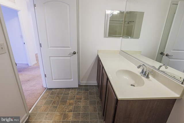 596 Claiborne Road, North East, MD 21901 - bathroom with baseboards, vanity, and stone finish floors