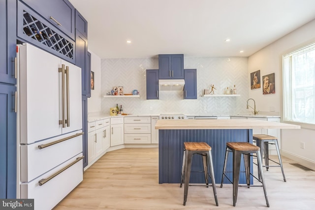 504 Richey Ave, Collingswood, NJ 08107 - kitchen featuring white appliances, open shelves, wooden counters, a breakfast bar, and recessed lighting
