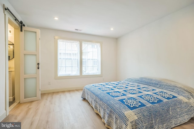 504 Richey Ave, Collingswood, NJ 08107 - bedroom featuring wood finished floors, a barn door, and recessed lighting