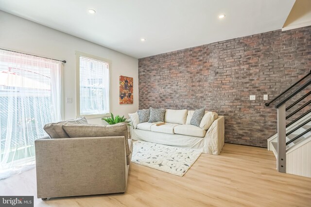 504 Richey Ave, Collingswood, NJ 08107 - living room featuring brick wall, wood finished floors, stairway, and recessed lighting