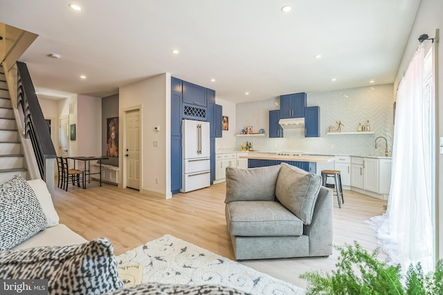 504 Richey Ave, Collingswood, NJ 08107 - living room featuring light wood-type flooring, recessed lighting, and stairs