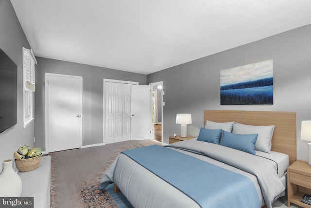bedroom with carpet flooring, baseboards, and multiple closets