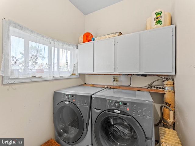 laundry room with cabinet space and washing machine and dryer