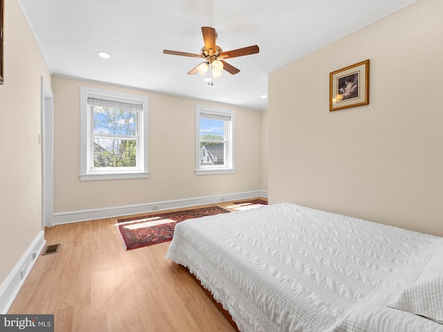 bedroom featuring baseboards, light wood-style floors, recessed lighting, and ceiling fan