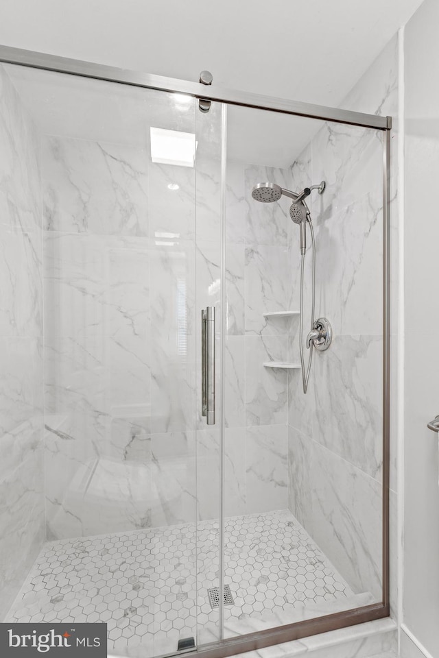 full bathroom with a shower stall